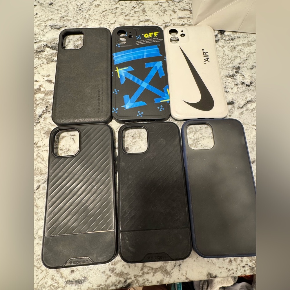 Spigen Black and White Phone Cases with Blue Accents